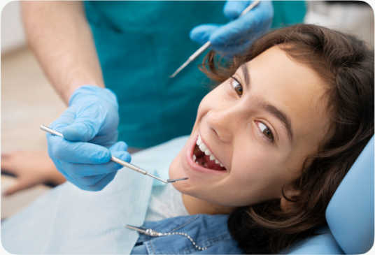 Happy young dental patient smiling during appointment with friendly dentist